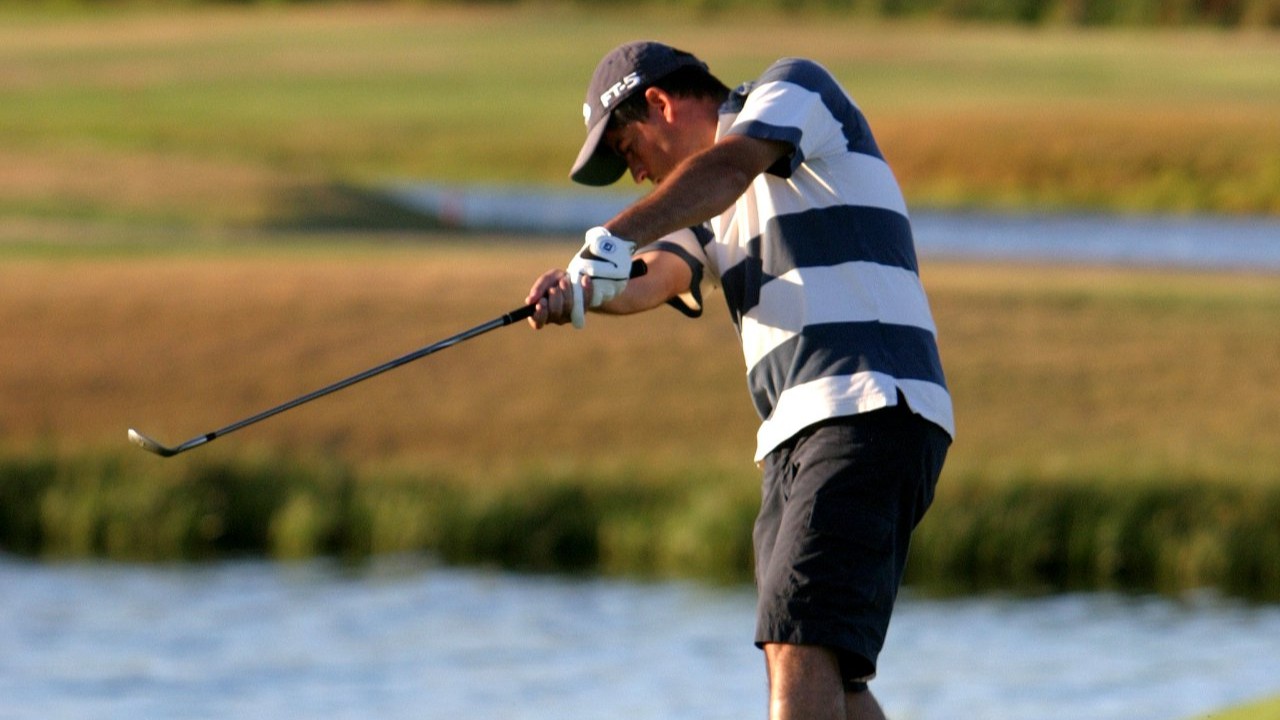 man swinging a golf club