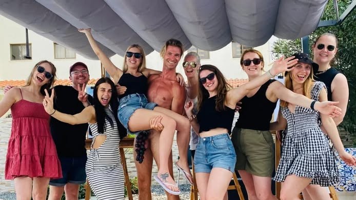 hunky male model with hen group