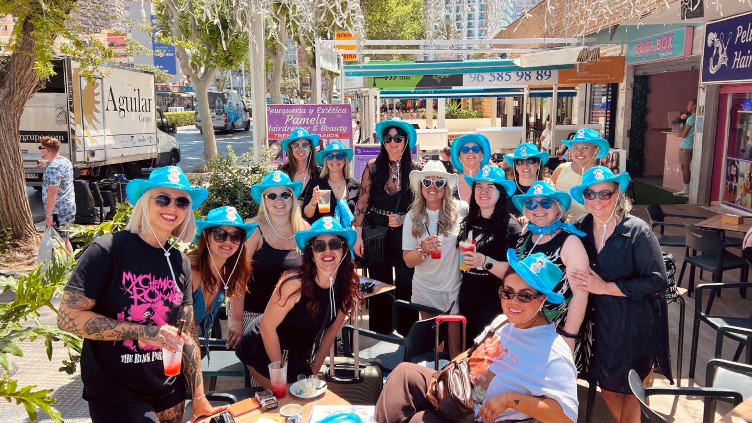 hen group in blue cowboy hats