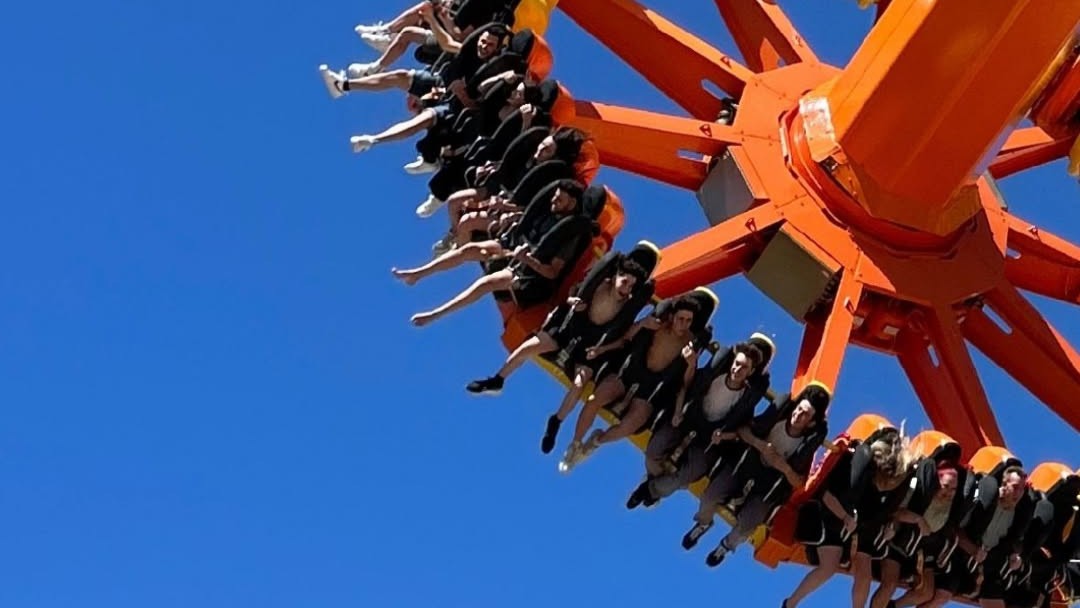 Group riding a high-speed thrill ride at Terra M&iacute;tica Benidorm