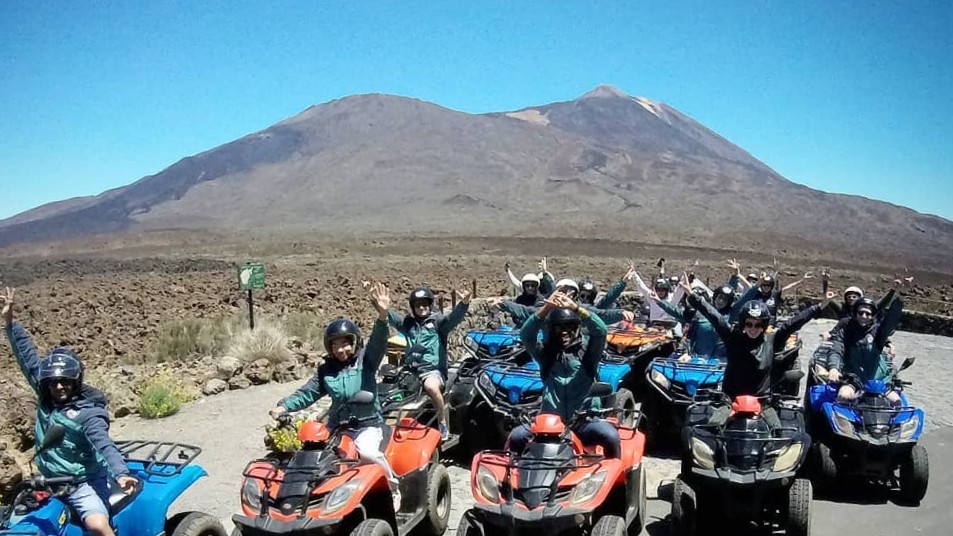 people on quad bikes in front of mt Teide