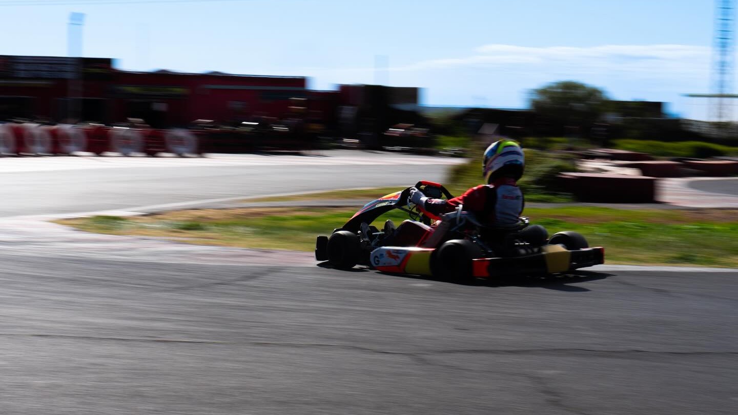 go-kart speeding on a track