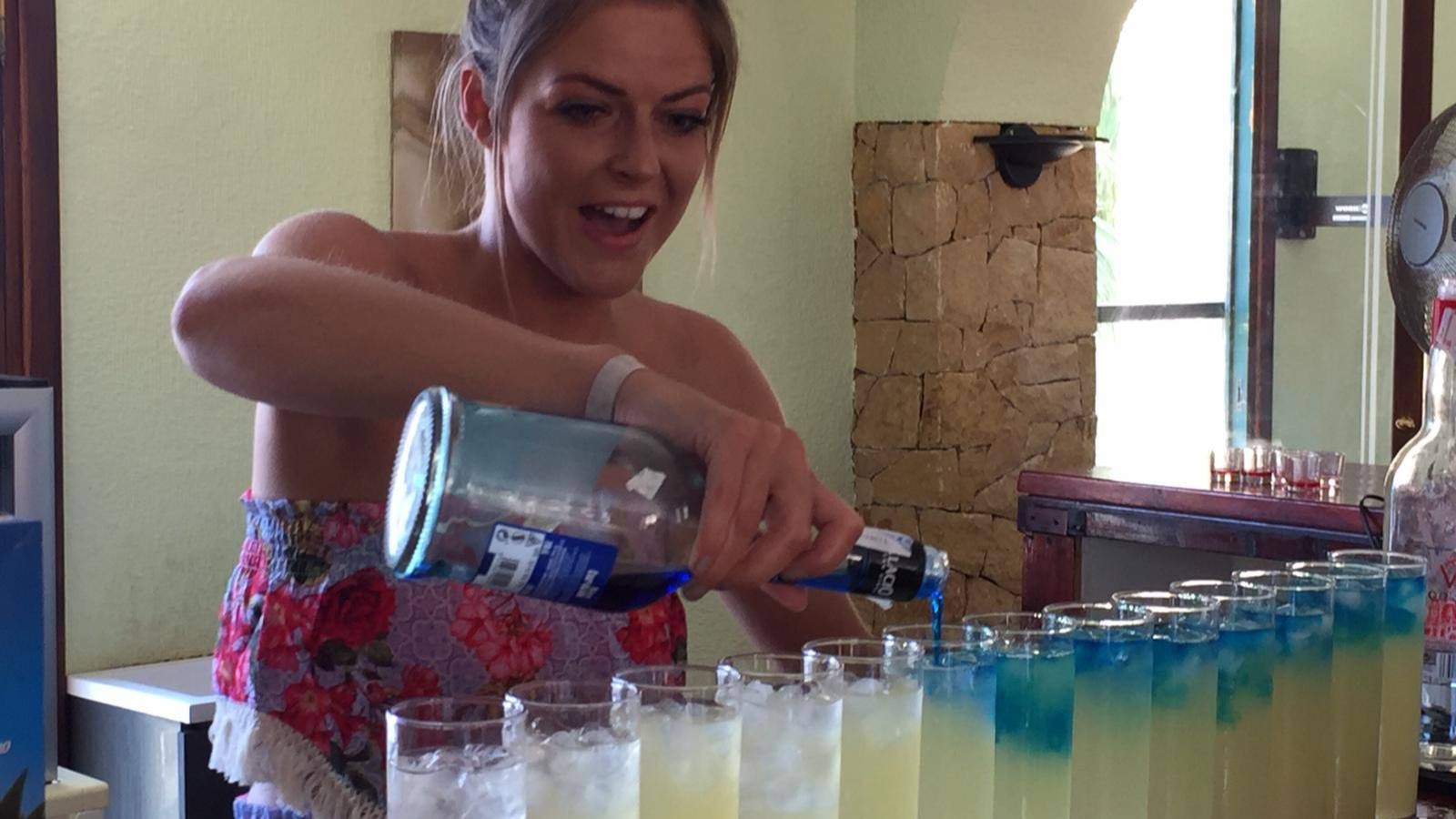 Hen group mixing cocktails on a sunny terrace in Benidorm