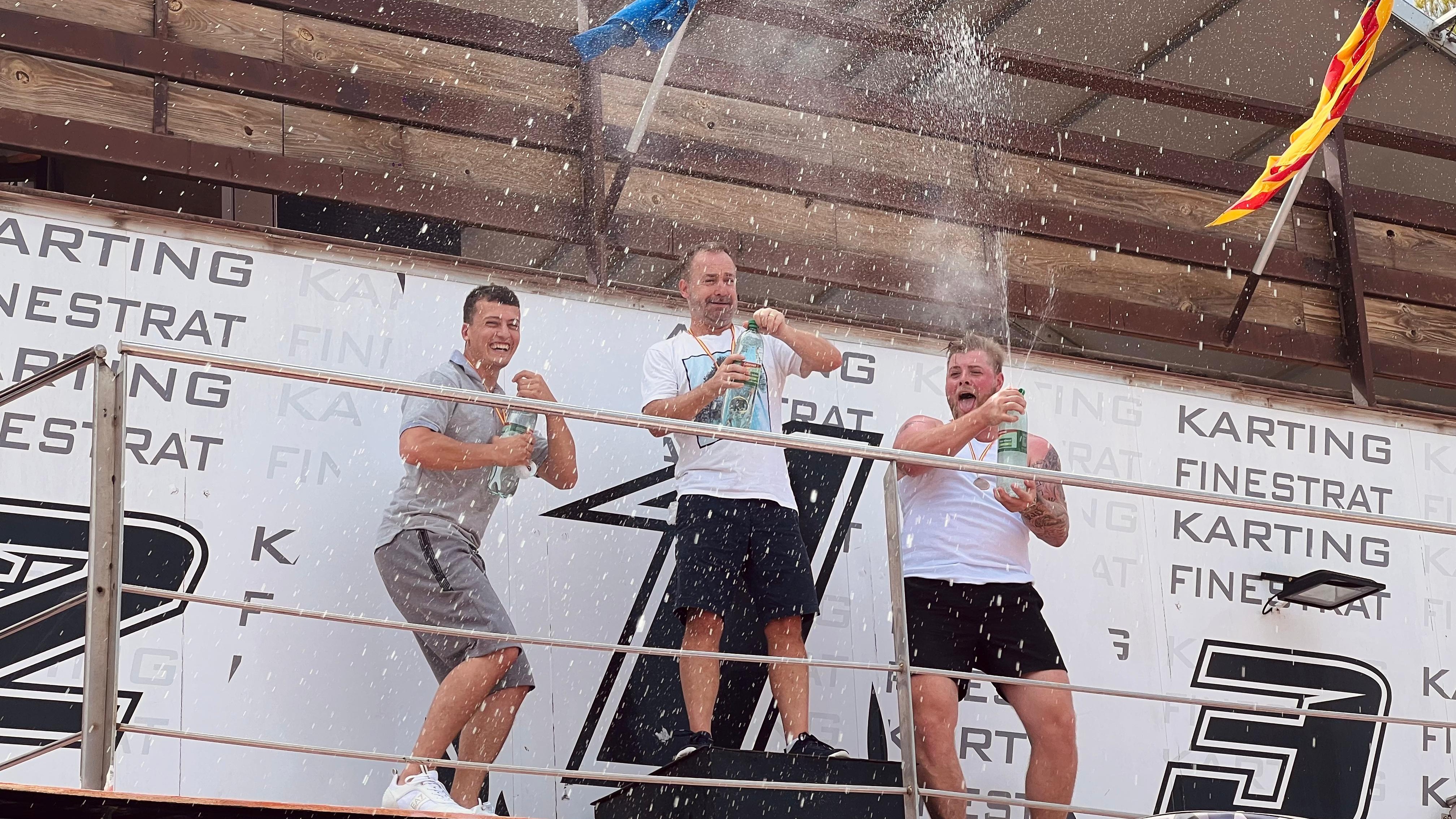 lads celebrating win at go karting